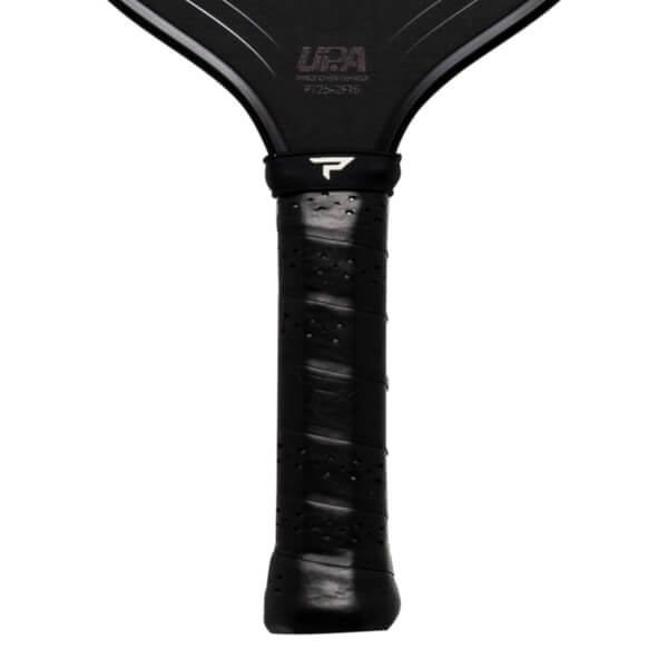 Close-up of the handle and upper neck of a black pickleball paddle, showing the "P" logo and "UAA" text.