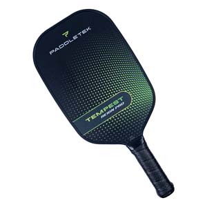 Top-down view of a black pickleball paddle with green gradient dots and TEMPEST REIGN PRO text.