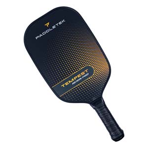 Top-down view of a black pickleball paddle with a gold gradient dot pattern and TEMPEST REIGN PRO text.