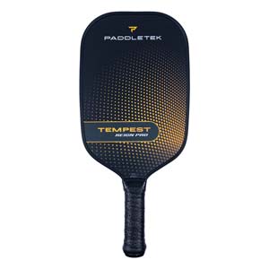 Front view of a black pickleball paddle with gold gradient dots and TEMPEST REIGN PRO text.