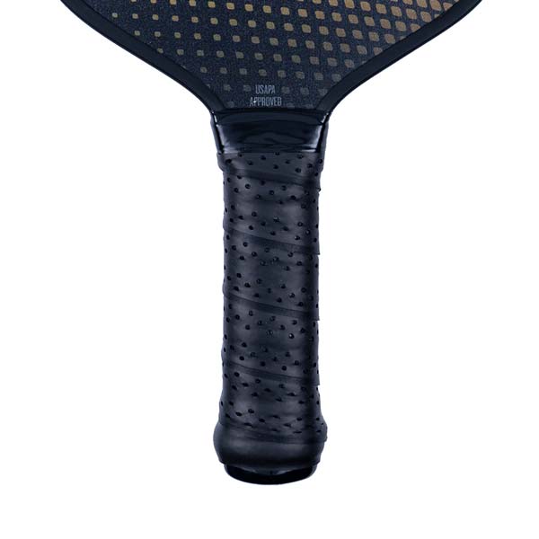 Close-up of a black pickleball paddle grip with perforated texture and USAPA APPROVED text.