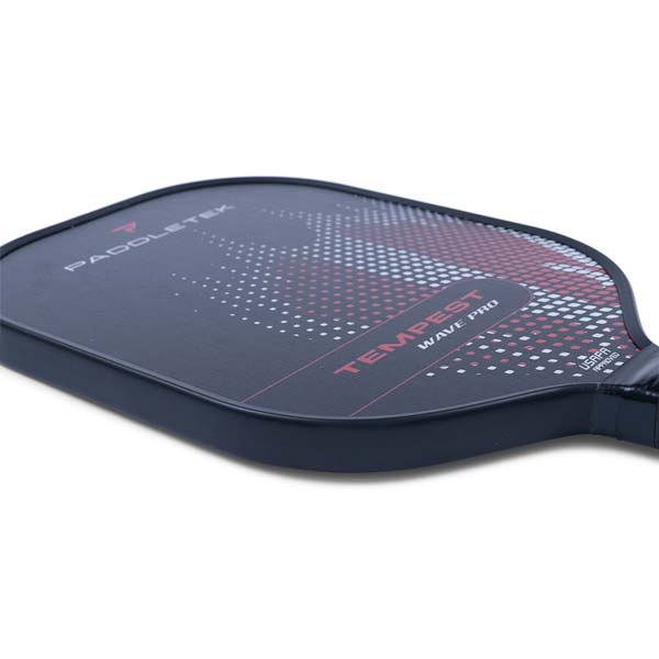 Side view of a black pickleball paddle with PADDLETEK and TEMPEST WAVE PRO text and a dotted pattern.