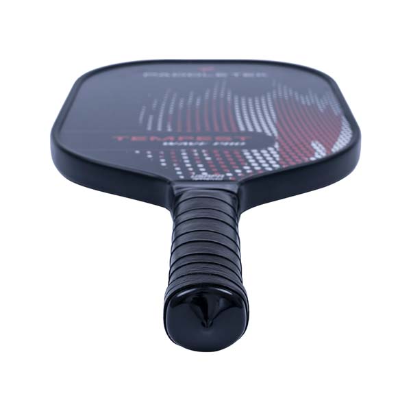 Top-down view of a black pickleball paddle with a textured grip and red and white dot pattern.