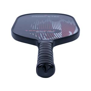 Top-down view of a black pickleball paddle with a textured grip and red and white dot pattern.