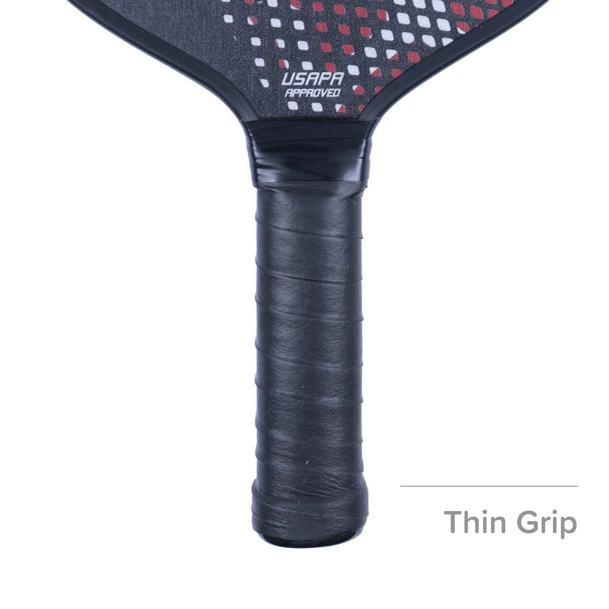 Close-up of a black pickleball paddle grip with USAPA APPROVED text and a red and white dot pattern.
