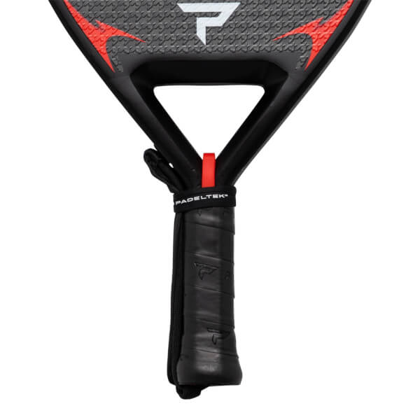 Close-up of a black padel racket grip with a red strap and "PADELTEK" text.