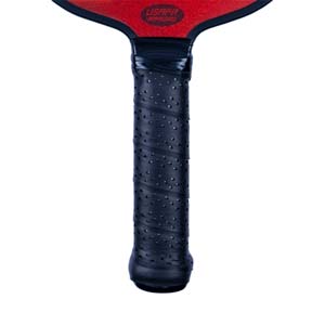 Close-up of a black pickleball paddle grip with a textured pattern and USAPA approved logo.