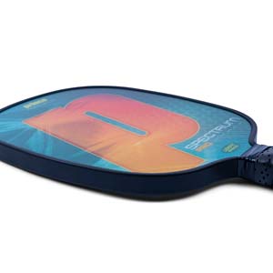 Side view of a blue pickleball paddle with a large orange R graphic, SPECTRUM PRO text, and USAPA approved stamp.
