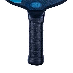 Close-up of a black pickleball paddle grip with USAPA APPROVED text on the paddle head.