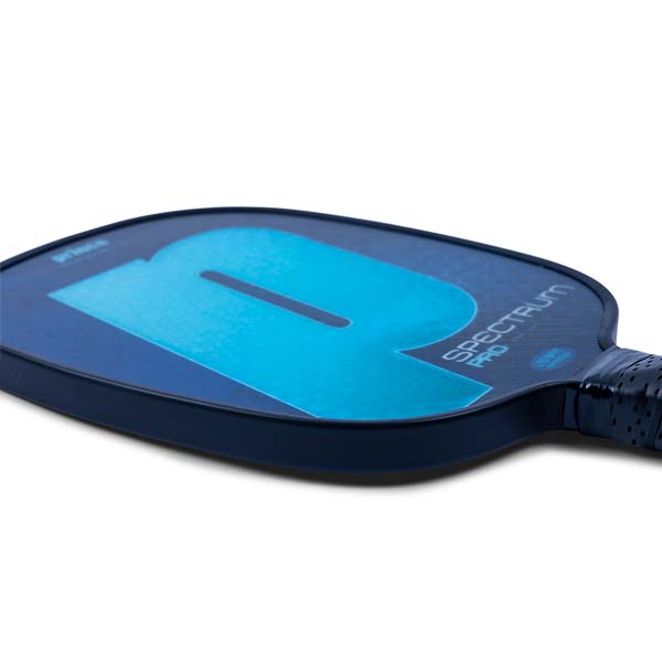 Side view of a blue pickleball paddle with a large blue P and SPECTRUM PRO text.