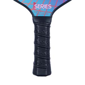 Close-up of a black pickleball paddle grip with perforations and the word SERIES visible.
