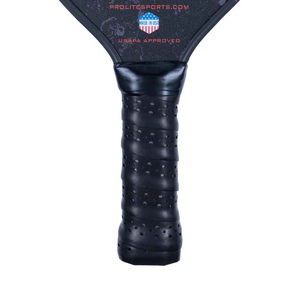 Close-up of a black pickleball paddle grip with perforations and USAPA APPROVED text.