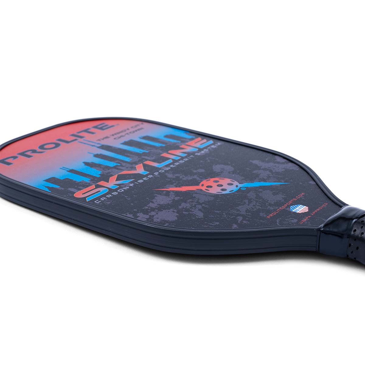 Corner view of a dark blue PROLITE pickleball paddle with a skyline graphic and the word SKYLINE.