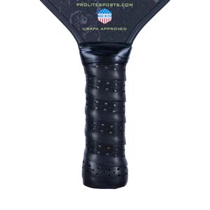 Close-up of a black pickleball paddle grip with perforations and USAPA APPROVED text.