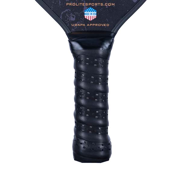 Close-up of a black pickleball paddle grip with perforations and USAPA APPROVED text.
