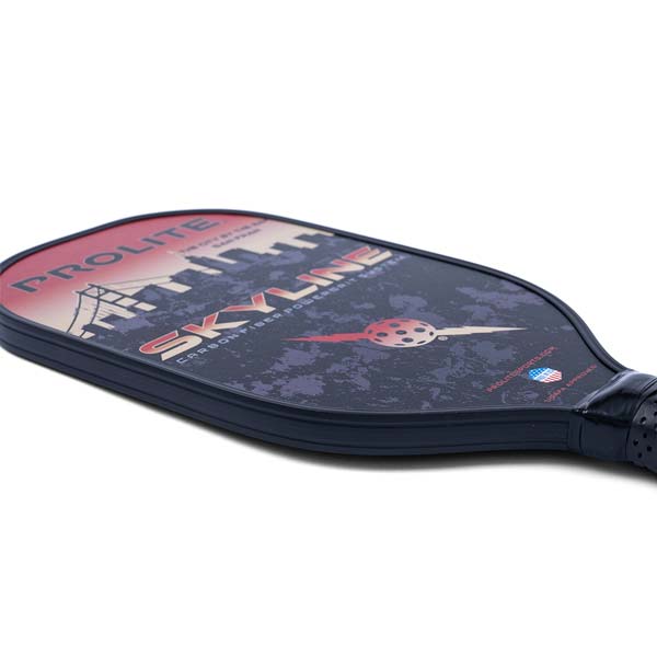 Side view of a black pickleball paddle with PROLITE and SKYLINE text, and a pickleball graphic.