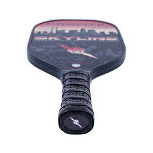 Top-down view of a black pickleball paddle with a skyline graphic and textured grip.