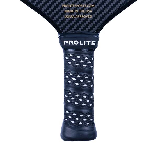 Close-up of a black pickleball paddle grip with white diamond pattern and PROLITE branding.