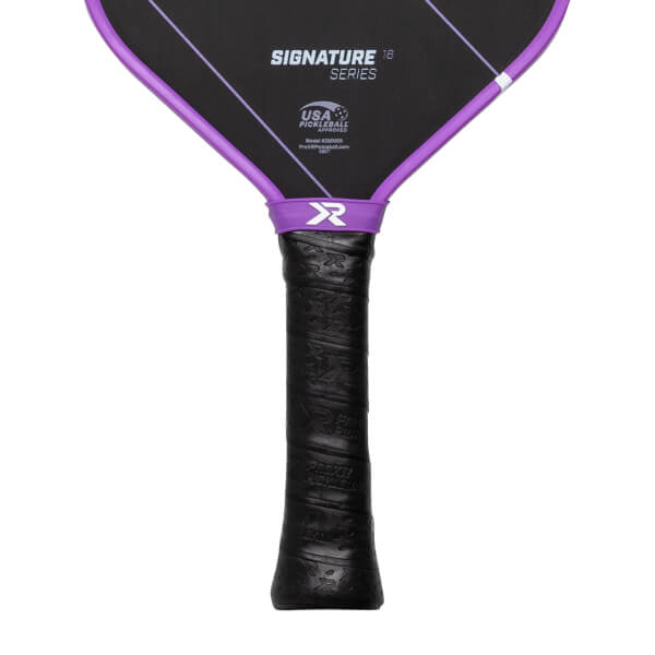 Close-up of a black pickleball paddle with a textured black grip, purple collar, and SIGNATURE SERIES text.