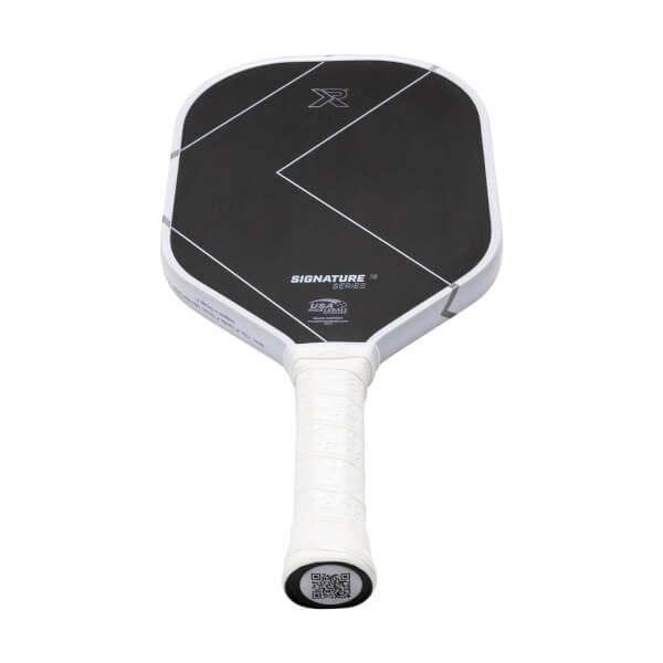 Front view of a black and white pickleball paddle with ProXR logo, geometric lines, and SIGNATURE SERIES text.