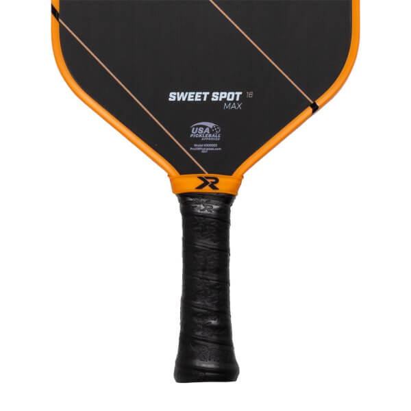 Close-up front view of a black pickleball paddle with SWEET SPOT 16 MAX text, an orange R logo, and a black textured grip.