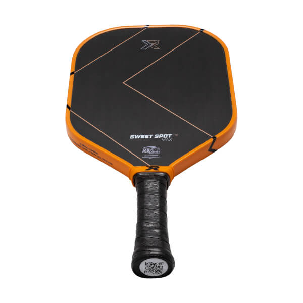 Angled top view of a black and orange pickleball paddle with SWEET SPOT MAX text and a black textured grip.