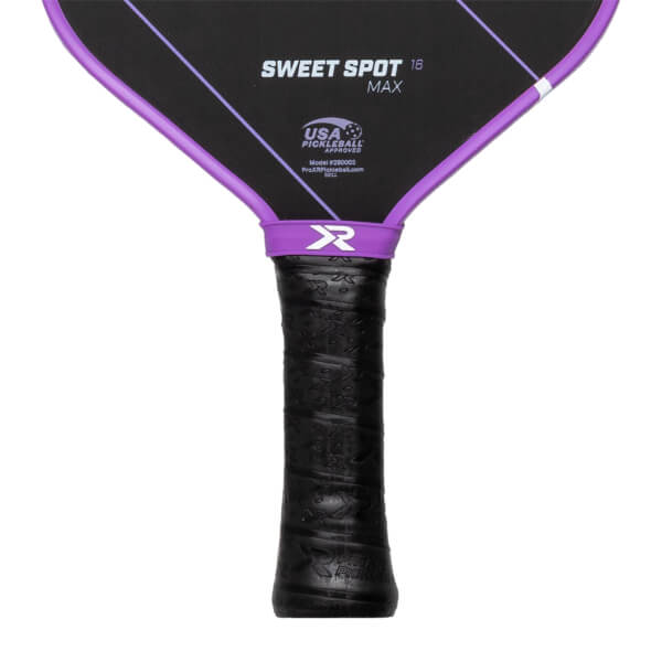 Close-up of a black pickleball paddle handle with a textured grip, purple collar, and SWEET SPOT MAX text on the face.