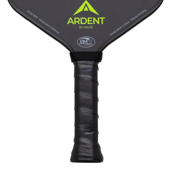 Close-up of the handle and lower paddle face, showing the black grip, "ARDENT" logo, and "USA PICKLEBALL APPROVED" seal.