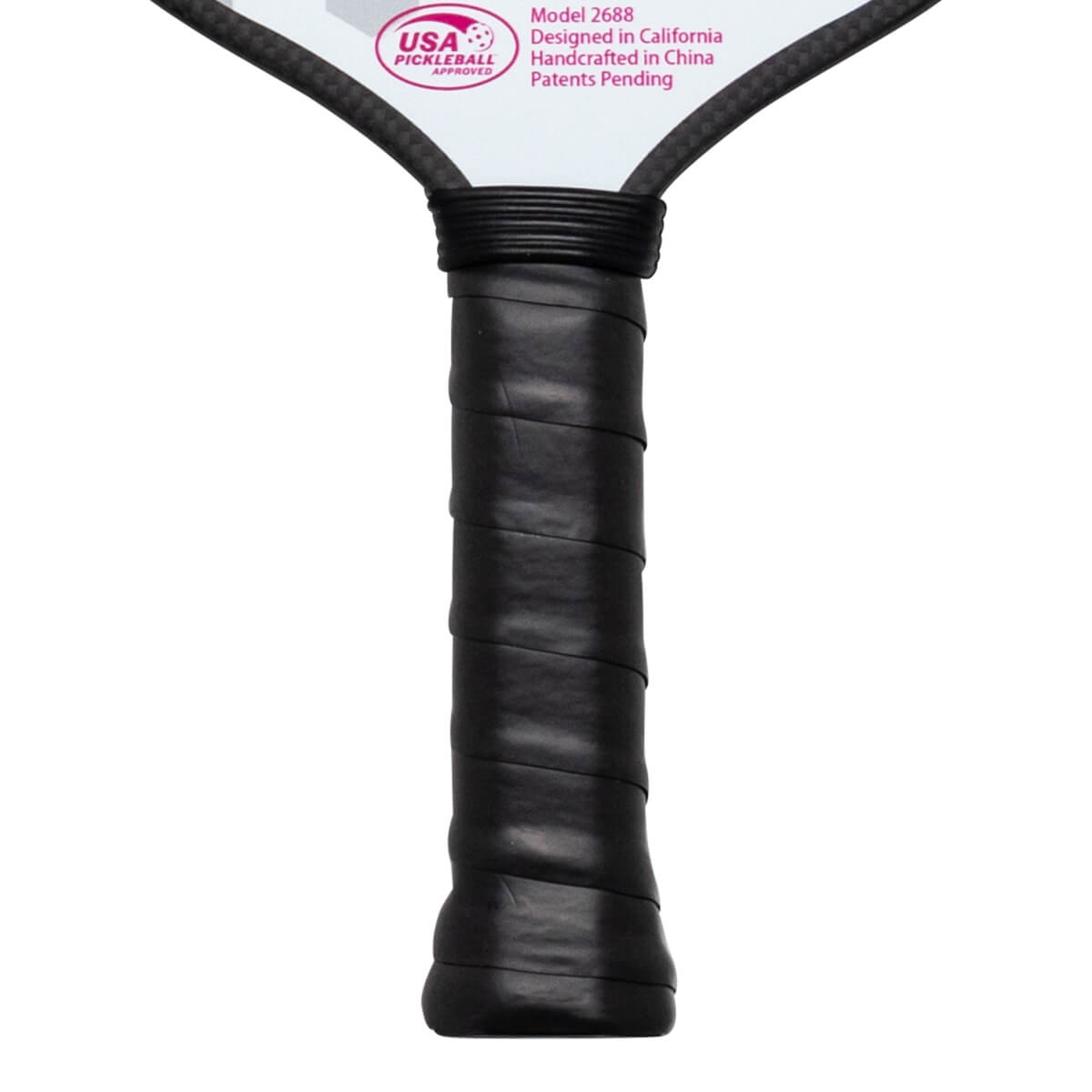 Close-up of a pickleball paddle grip showing the black textured handle and the "USA PICKLEBALL APPROVED" logo.