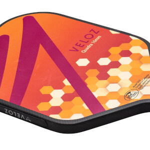 Top-down view of a pickleball paddle with orange and purple geometric patterns, the word VELOZ, and a USA Pickleball Approved logo.