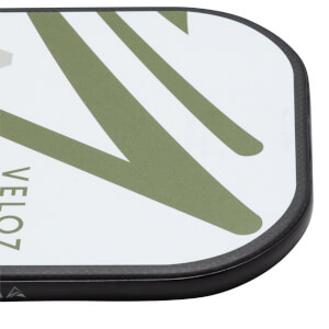 Corner view of a white paddle with green stripes and "VELO7" text.