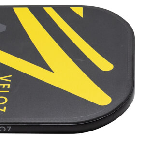 Corner view of the ProXR x Veloz Quadra paddle, showing yellow "VELOZ" text and black carbon fiber.