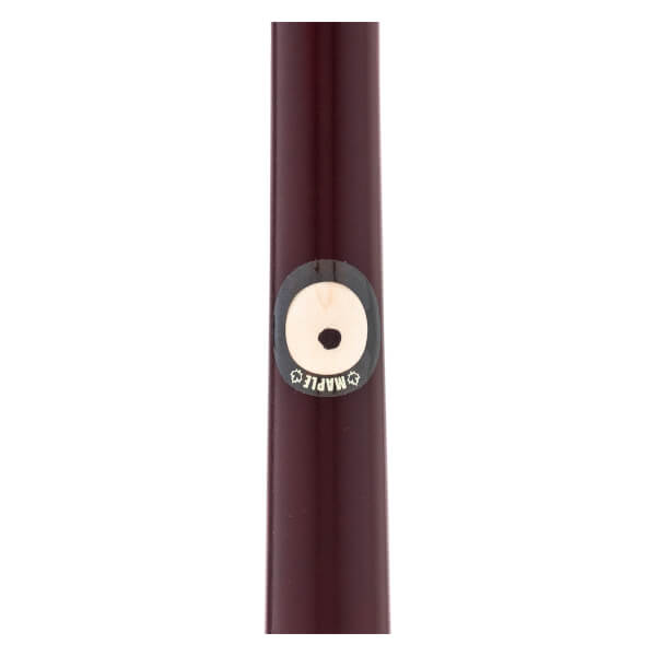 Close-up of a dark reddish-brown maple wood baseball bat with a circular MAPLE label and a central black dot.