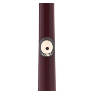 Close-up of a dark reddish-brown maple wood baseball bat with a circular MAPLE label and a central black dot.
