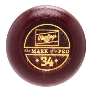 Close-up of the maroon baseball bats barrel end with a gold Rawlings logo, The MARK of a PRO text, and the number 34.