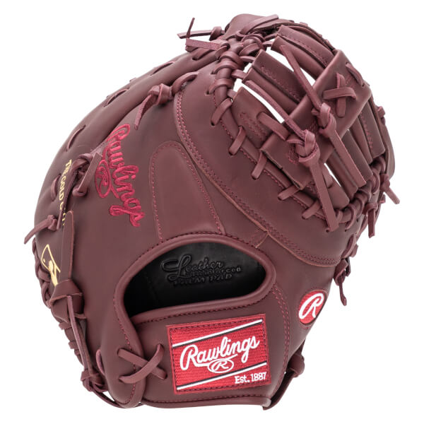 Close-up of a maroon baseball glove showing the Rawlings logo, "The Gold Glove" text, and reinforced palm pad.