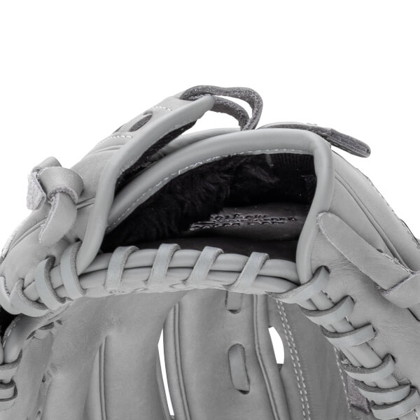 Close-up of a gray baseball glove showing the lacing and interior lining.