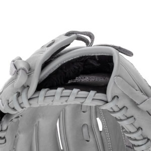 Close-up of a gray baseball glove showing the lacing and interior lining.