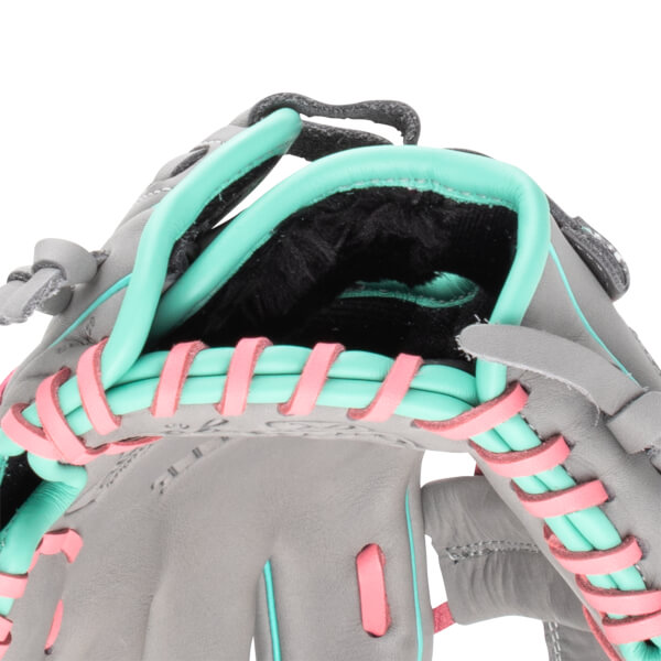 Close-up view of a grey baseball glove with teal and pink lacing and a black interior.