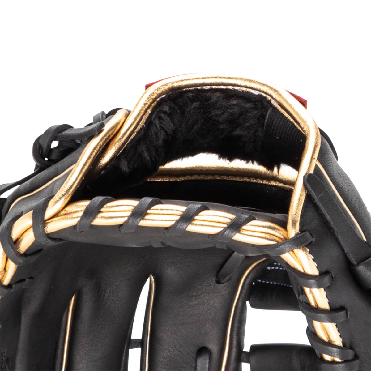 Close-up of the interior of a black baseball glove with gold trim and black fur lining.