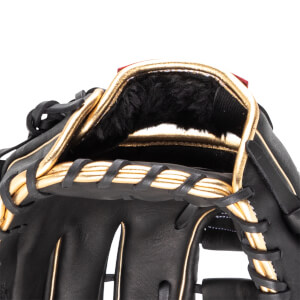 Close-up of the interior of a black baseball glove with gold trim and black fur lining.