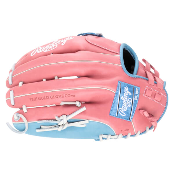 Top-down view of a pink Rawlings baseball glove with blue accents and white lacing, featuring "Rawlings" and "Est. 1887" logos.