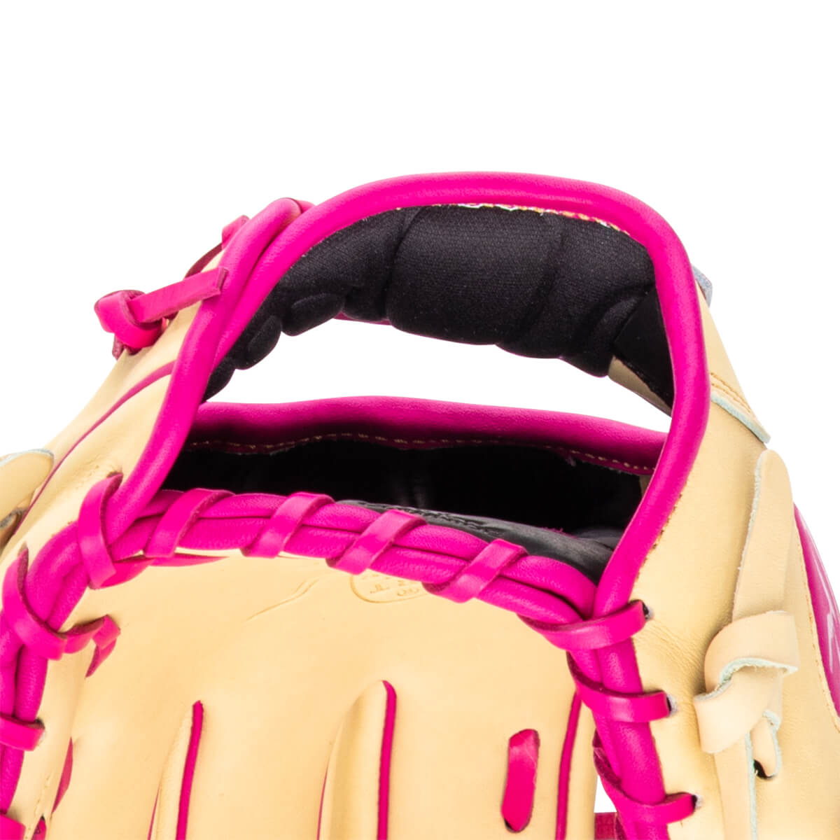Close-up of a tan baseball glove with bright pink lacing and a padded wrist strap.