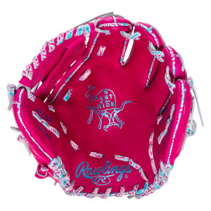 Top-down view of a pink baseball glove with blue and white wavy trim, featuring the Rawlings logo and a "Heart of the Hide" emblem.