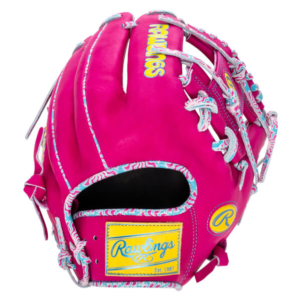 Front view of a bright pink baseball glove with a yellow Rawlings patch and colorful wavy trim.