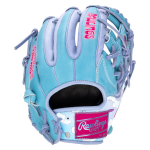 Front view of a light blue baseball glove with pink "Rawlings" logo and cloud and moon pattern.