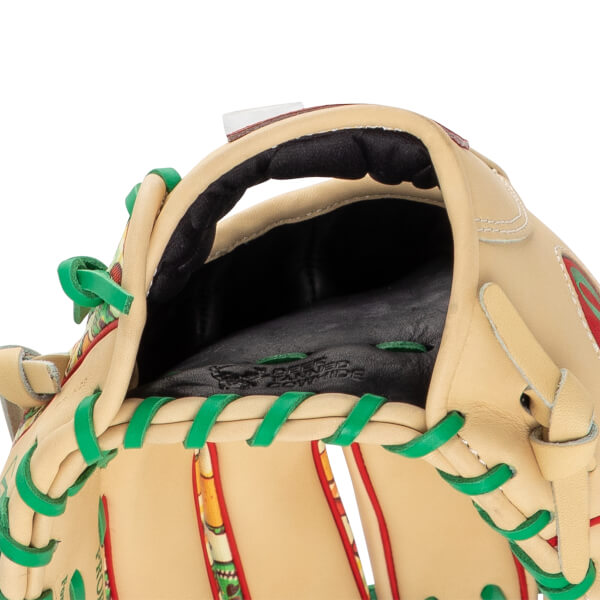 Close-up view of the baseball glove's interior wrist opening featuring black padding, green laces, and embossed text reading "DEER TANNED COWHIDE."
