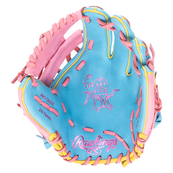 Top-down view of a blue baseball glove with pink and yellow accents, featuring "Rawlings" and "Heart of the Hide" logos.