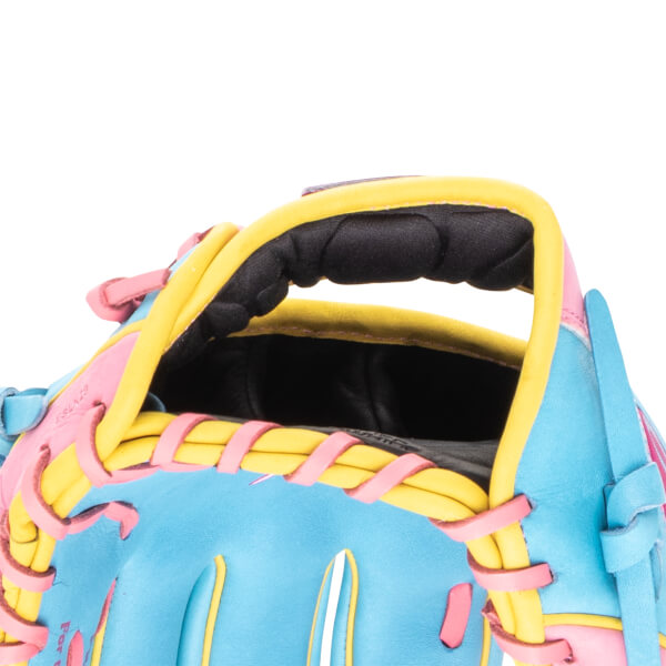 Close-up of a baseball glove showing the pink lacing, yellow trim, and blue leather.