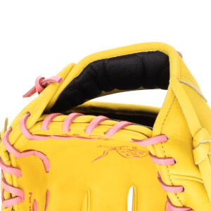 Close-up of a yellow baseball glove showing pink lacing and a black padded interior.